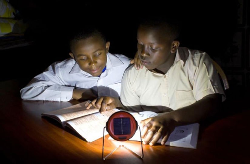 Children studying under solar light